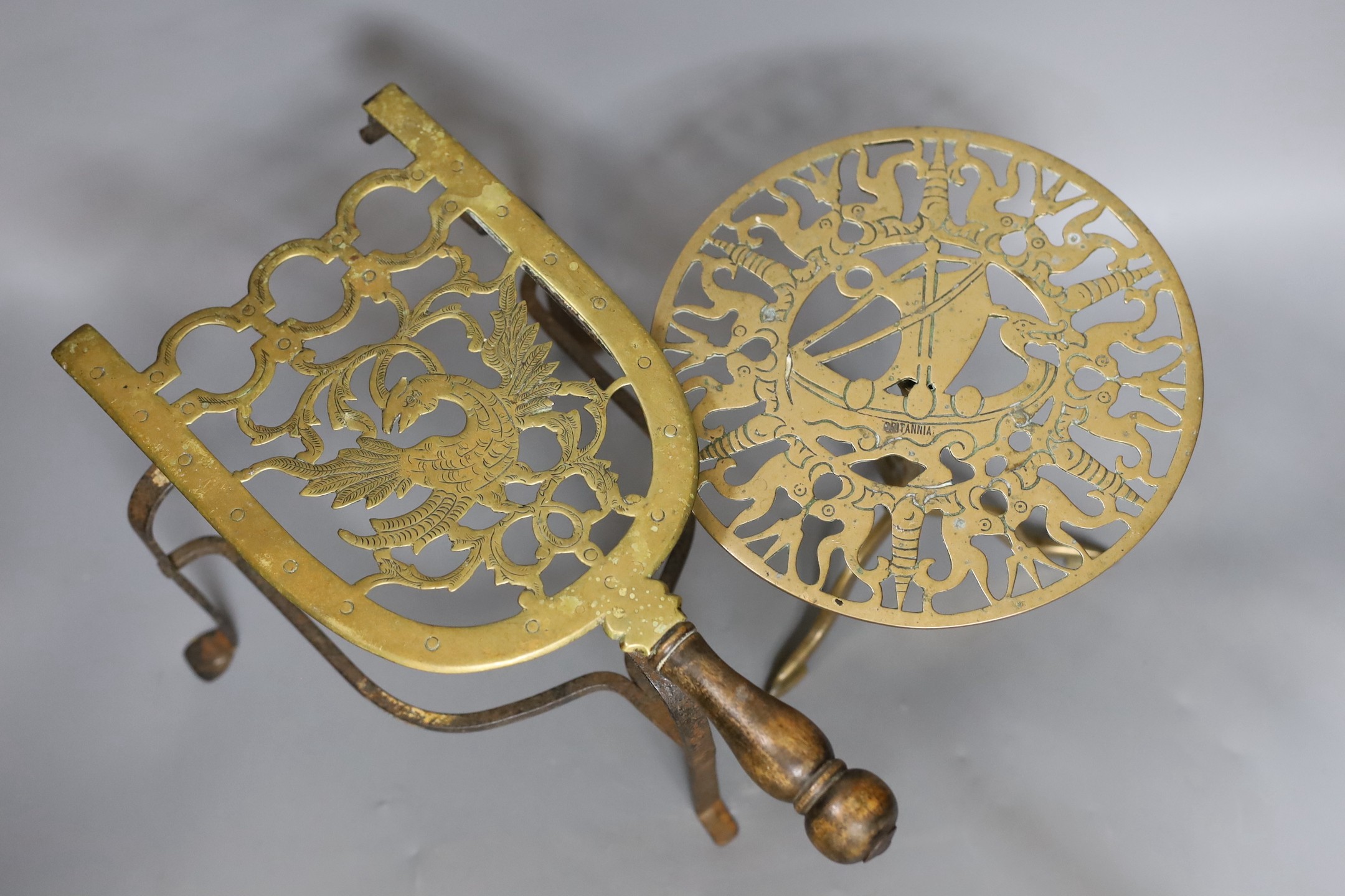 A George III brass trivet and a Victorian miniature brass tripod table